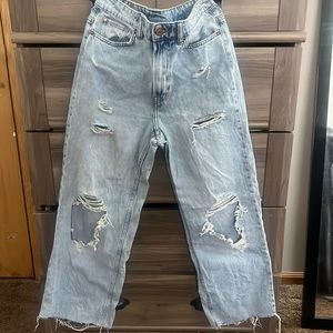 light washed blue straight leg ripped mom jeans